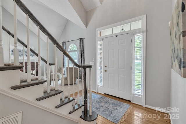 5775 Monticello Dr NW, Concord, NC 28027 - foyer entrance with stairway, visible vents, plenty of natural light, and hardwood / wood-style flooring