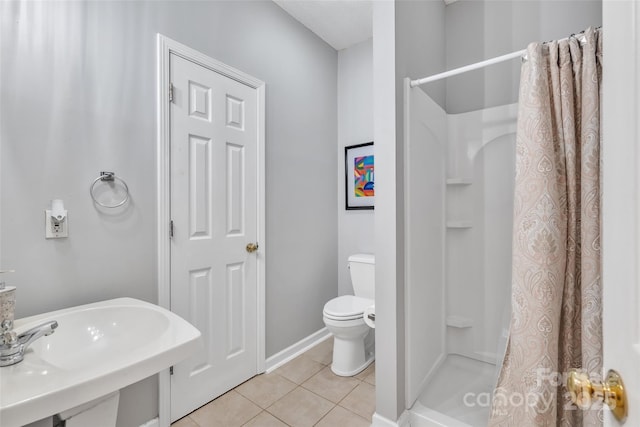 5775 Monticello Dr NW, Concord, NC 28027 - full bathroom with a stall shower, a sink, tile patterned floors, baseboards, and toilet