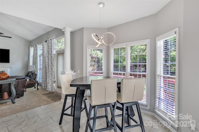 5775 Monticello Dr NW, Concord, NC 28027 - dining room with ornate columns, a notable chandelier, lofted ceiling, and marble finish floor