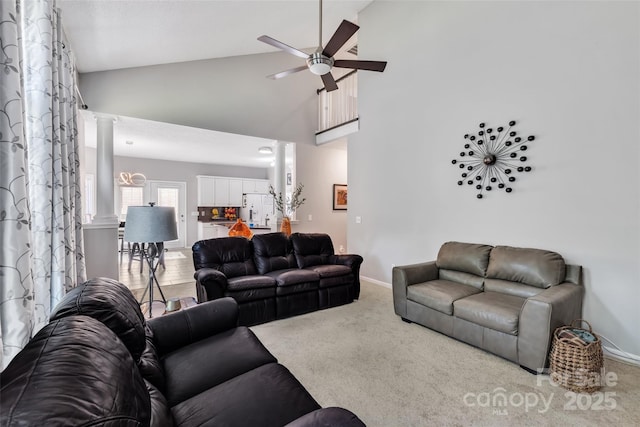5775 Monticello Dr NW, Concord, NC 28027 - living area featuring ceiling fan, decorative columns, baseboards, high vaulted ceiling, and carpet flooring