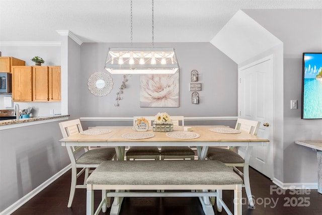8814 Gerren Ct, Charlotte, NC 28217 - dining space featuring ornamental molding, baseboards, breakfast area, a textured ceiling, and dark wood finished floors