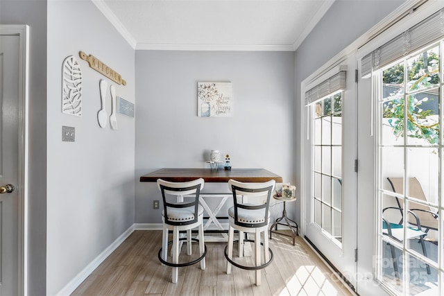 8814 Gerren Ct, Charlotte, NC 28217 - dining space featuring baseboards, ornamental molding, and wood finished floors