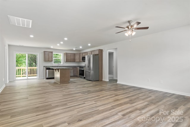 kitchen featuring appliances with stainless steel finishes, visible vents, recessed lighting, and open floor plan