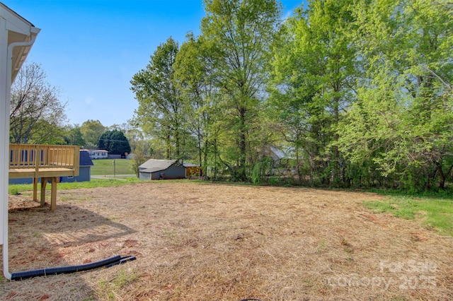 view of yard with a deck
