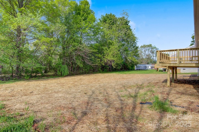 view of yard with a deck