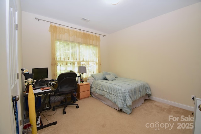 bedroom with visible vents and carpet floors