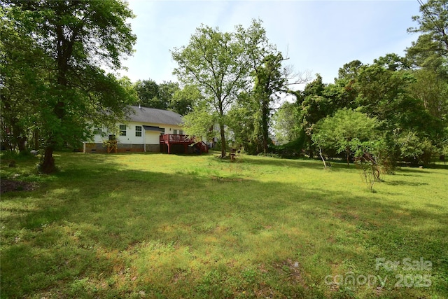 view of yard featuring a deck