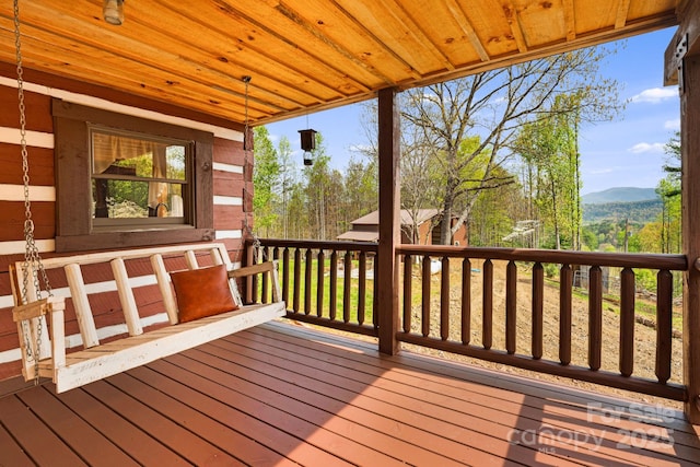 wooden deck with a mountain view