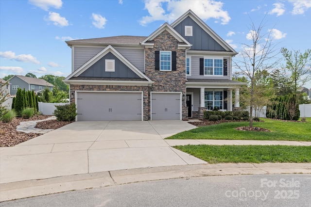 craftsman-style house with an attached garage, board and batten siding, concrete driveway, and stone siding