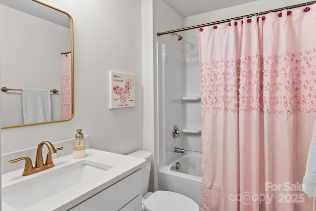 bathroom featuring shower / bath combination with curtain, toilet, and vanity