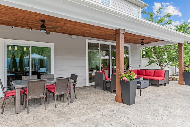 view of patio / terrace featuring a ceiling fan, an outdoor living space, and outdoor dining area