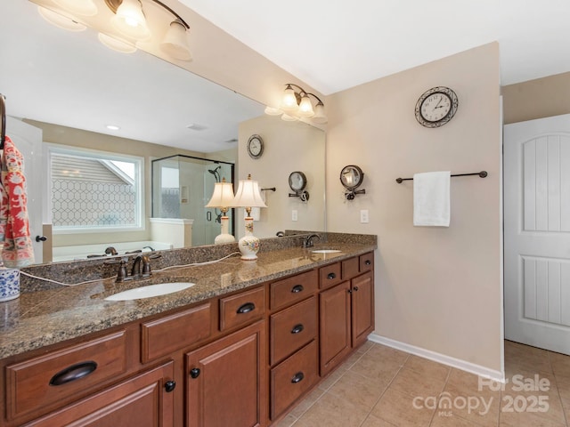 79044 Ridgehaven Rd, Lancaster, SC 29720 - full bath featuring a stall shower, tile patterned floors, double vanity, and baseboards