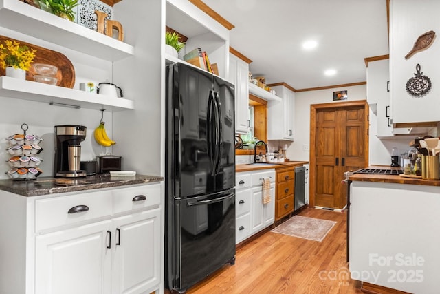 10139 Arlington Church Rd, Mint Hill, NC 28227 - kitchen featuring white cabinets, a sink, light wood-type flooring, freestanding refrigerator, and open shelves