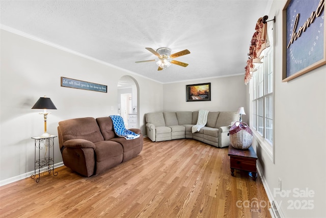 300 Scotland Dr, Kings Mountain, NC 28086 - living area with arched walkways, wood finished floors, a ceiling fan, baseboards, and ornamental molding