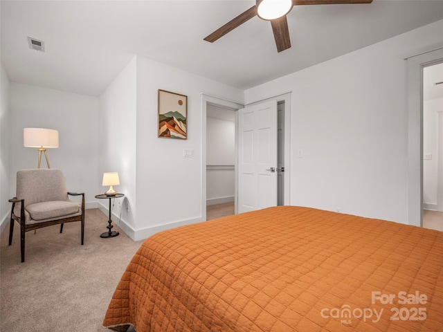 carpeted bedroom featuring baseboards, visible vents, and ceiling fan