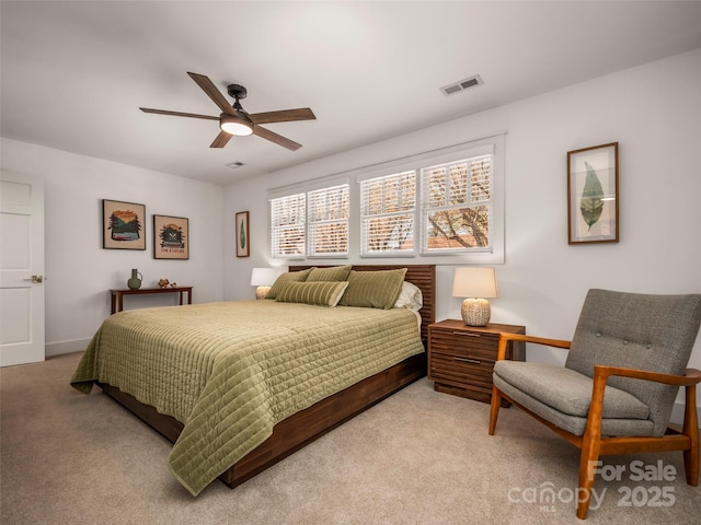 bedroom with a ceiling fan, visible vents, carpet, and baseboards