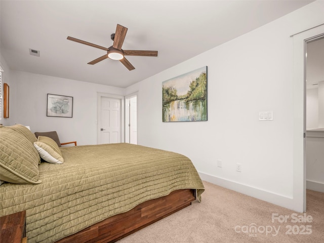 bedroom featuring a ceiling fan, visible vents, carpet floors, and baseboards