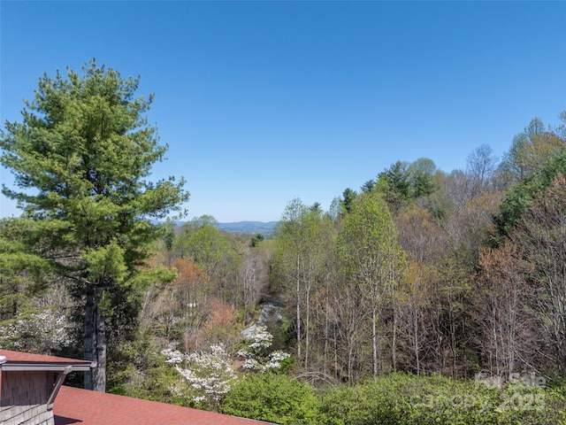 property view of mountains with a forest view