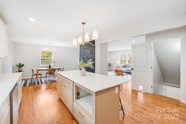16 Graystone Rd, Asheville, NC 28804 - kitchen featuring light countertops, dishwasher, light wood finished floors, and a notable chandelier