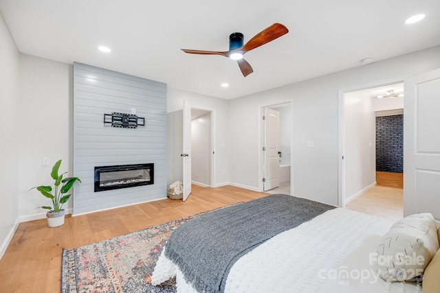 16 Graystone Rd, Asheville, NC 28804 - bedroom featuring recessed lighting, baseboards, a large fireplace, and wood finished floors