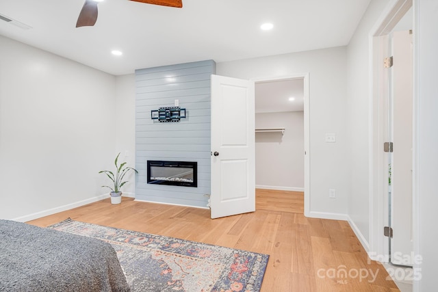16 Graystone Rd, Asheville, NC 28804 - living area with visible vents, a fireplace, light wood-style floors, baseboards, and ceiling fan