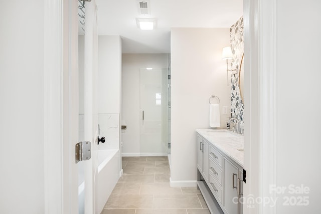 16 Graystone Rd, Asheville, NC 28804 - bathroom with vanity, visible vents, baseboards, a bath, and a stall shower