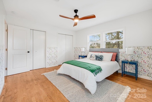 16 Graystone Rd, Asheville, NC 28804 - bedroom with multiple closets, ceiling fan, and light wood finished floors