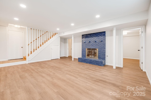 16 Graystone Rd, Asheville, NC 28804 - unfurnished living room featuring a fireplace, baseboards, stairway, recessed lighting, and light wood-style flooring