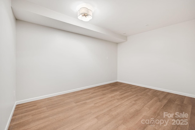 16 Graystone Rd, Asheville, NC 28804 - spare room featuring baseboards and light wood-style flooring