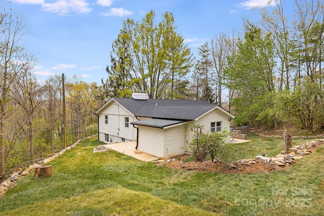 16 Graystone Rd, Asheville, NC 28804 - view of side of home featuring a lawn, a chimney, and a patio area