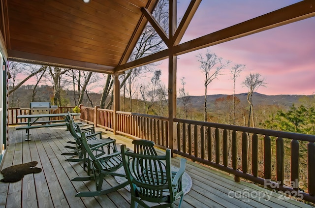 wooden terrace featuring grilling area