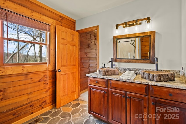 bathroom featuring visible vents and vanity