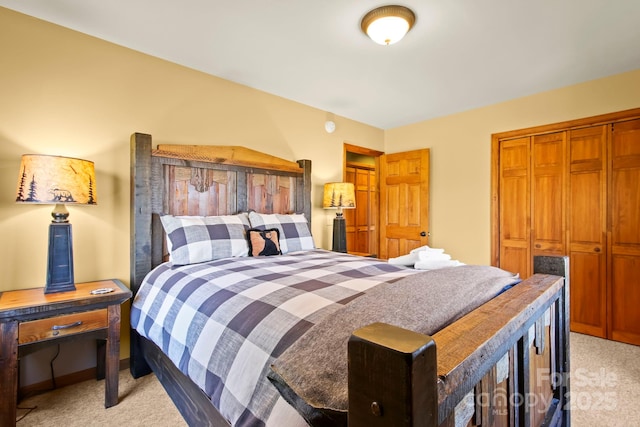 bedroom with light carpet and a closet