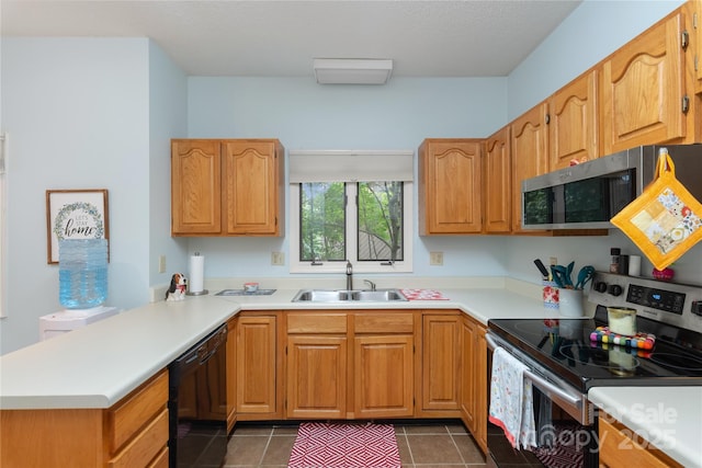 305 Piney Mountain Dr Unit R1, Asheville, NC 28805 - kitchen with a sink, stainless steel appliances, a peninsula, and light countertops