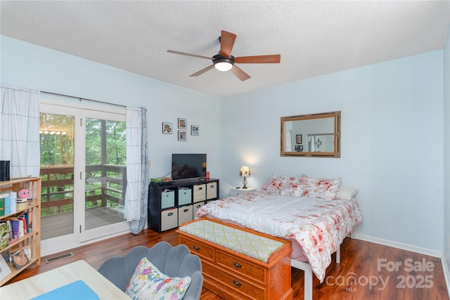 305 Piney Mountain Dr Unit R1, Asheville, NC 28805 - bedroom with access to exterior, wood finished floors, a ceiling fan, and a textured ceiling