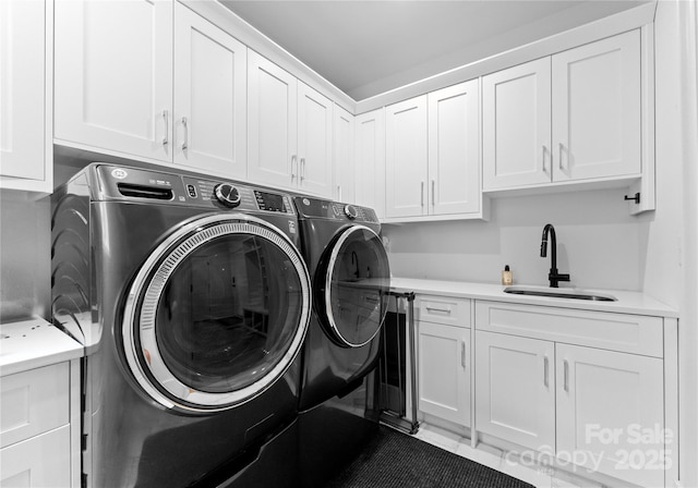 3933 Ayrshire Pl, Charlotte, NC 28210 - laundry area with a sink, cabinet space, and independent washer and dryer