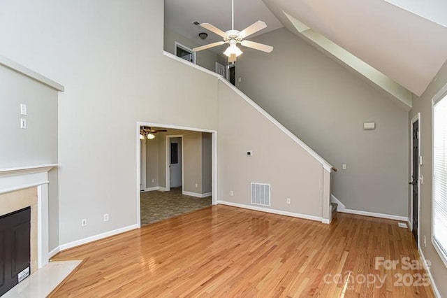 1930 Manning Pl, Rock Hill, SC 29730 - unfurnished living room with stairway, ceiling fan, high vaulted ceiling, and visible vents