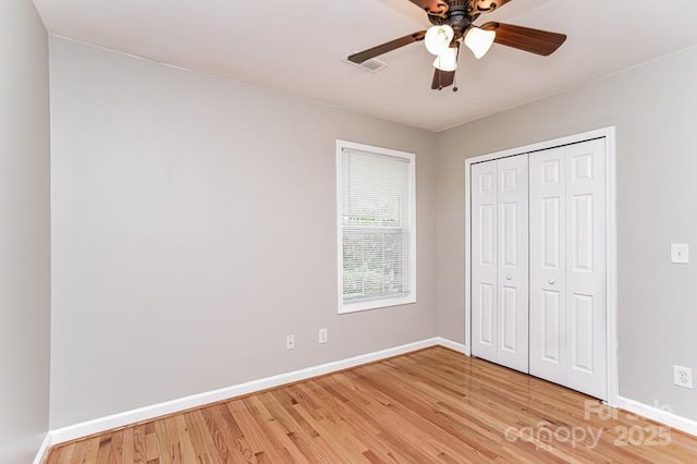 1930 Manning Pl, Rock Hill, SC 29730 - unfurnished bedroom with light wood-style floors, a closet, a ceiling fan, and baseboards