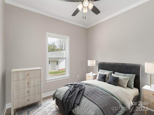 21 Kathy Dr, Waynesville, NC 28786 - bedroom with crown molding, baseboards, wood finished floors, and a ceiling fan