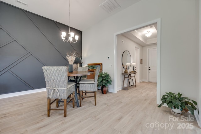 3029 Trace Meadow Ct, York, SC 29745 - dining room with a chandelier, light wood-type flooring, visible vents, and a tray ceiling