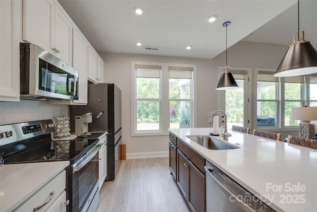 3029 Trace Meadow Ct, York, SC 29745 - kitchen featuring light countertops, visible vents, appliances with stainless steel finishes, and a sink