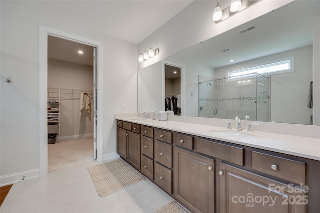3029 Trace Meadow Ct, York, SC 29745 - bathroom with double vanity, visible vents, a stall shower, and a sink