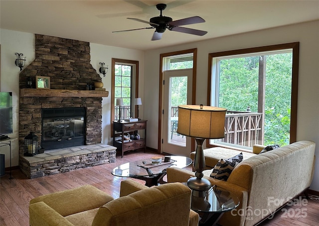 222 Creekside Way, Burnsville, NC 28714 - living area with ceiling fan, wood finished floors, and a fireplace