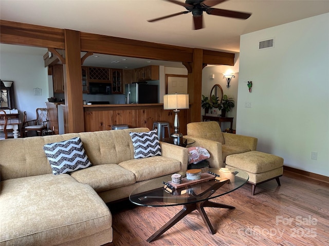 222 Creekside Way, Burnsville, NC 28714 - living room featuring ceiling fan and wood finished floors