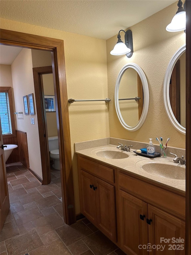 222 Creekside Way, Burnsville, NC 28714 - full bathroom with double vanity and stone tile floors
