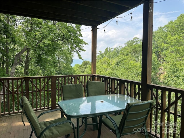 222 Creekside Way, Burnsville, NC 28714 - deck with outdoor dining space and a view of trees