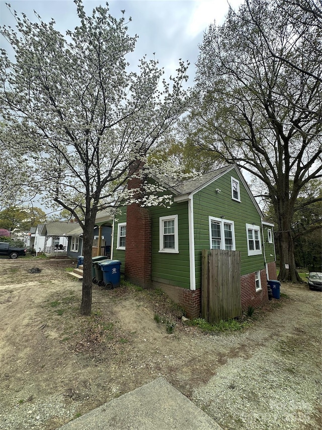 view of side of property with a chimney