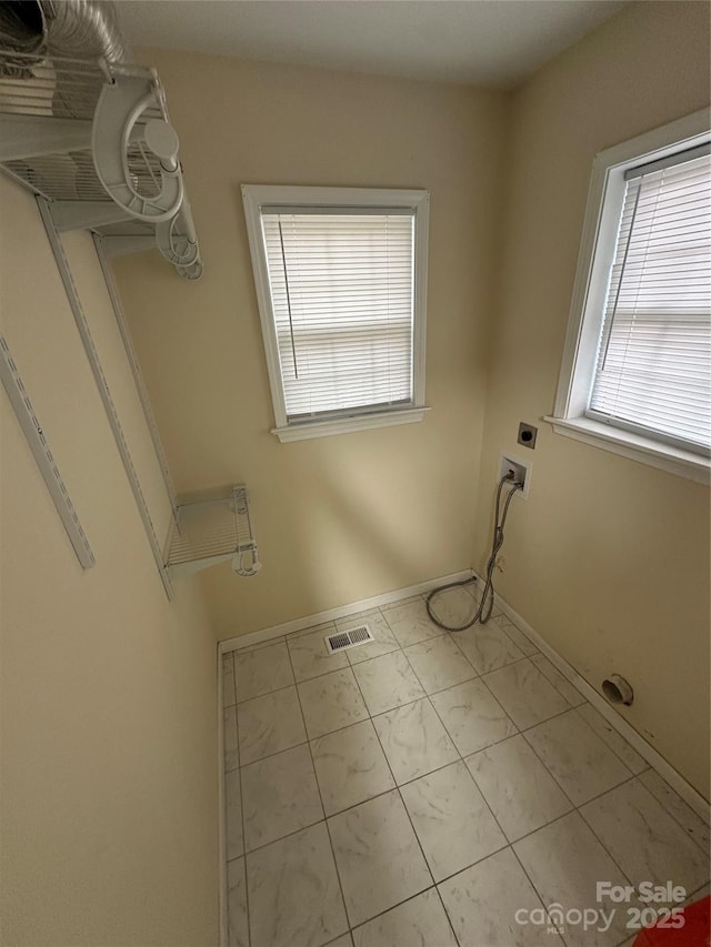 laundry room featuring washer hookup, hookup for an electric dryer, laundry area, visible vents, and marble finish floor