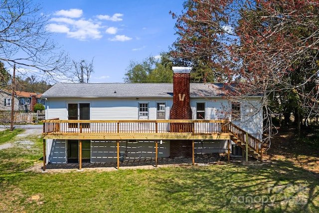 back of house with central AC, a chimney, a lawn, a deck, and stairs