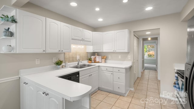 kitchen featuring white cabinets, a sink, light countertops, recessed lighting, and black dishwasher